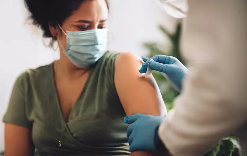 person getting a COVID vaccine