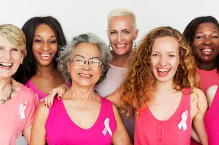 Women wearing pink in honor of Breast Cancer Awareness Month