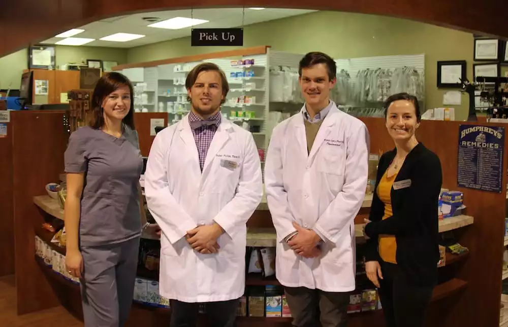 Staff and Pharmacists standing inside of Riverside Village Pharmacy